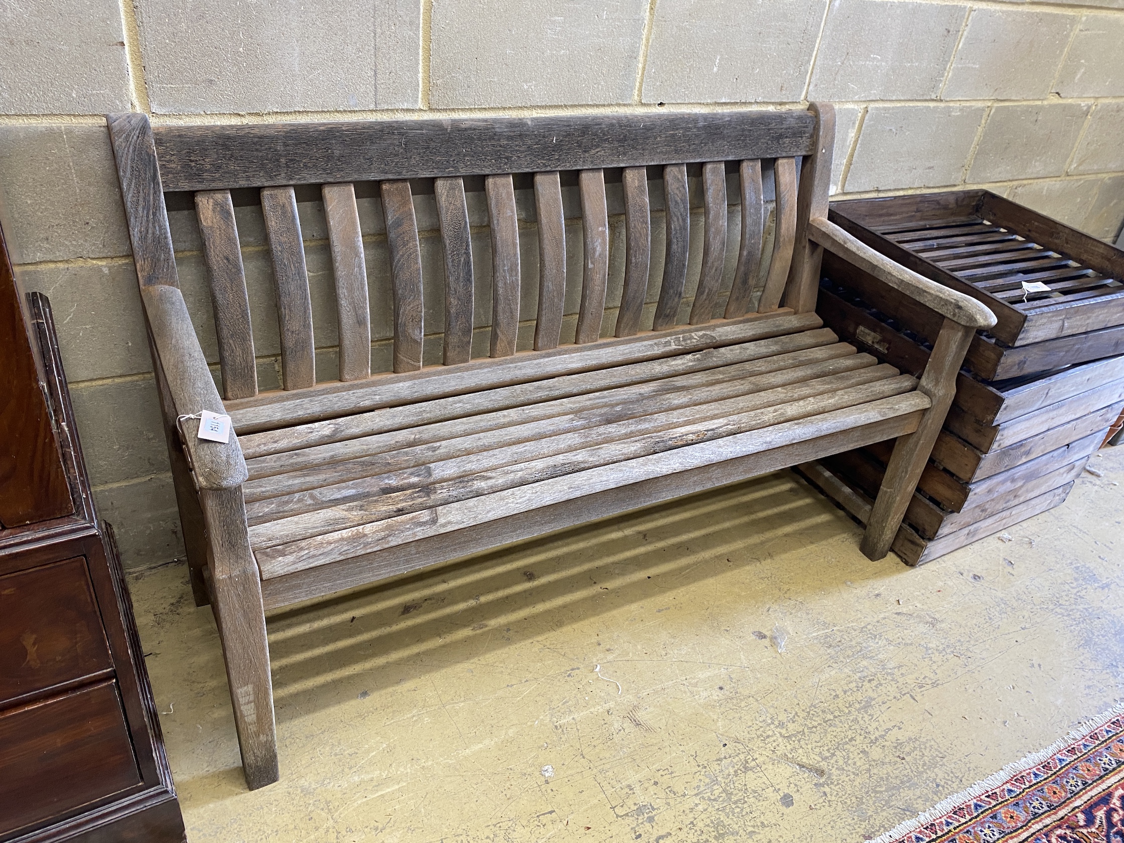 An Alexander Rose weathered teak garden bench, length 148cm, depth 60cm, height 90cm